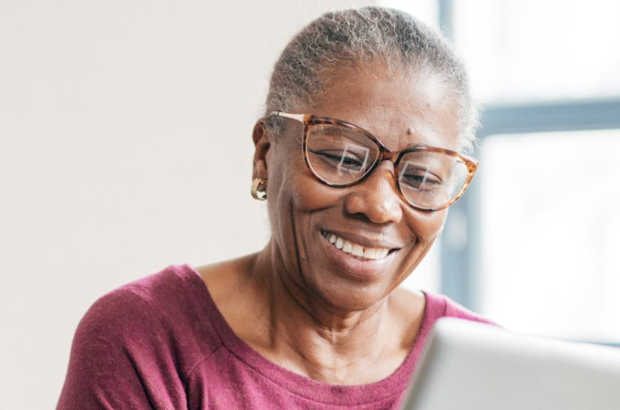 woman wearing glasses and smiling